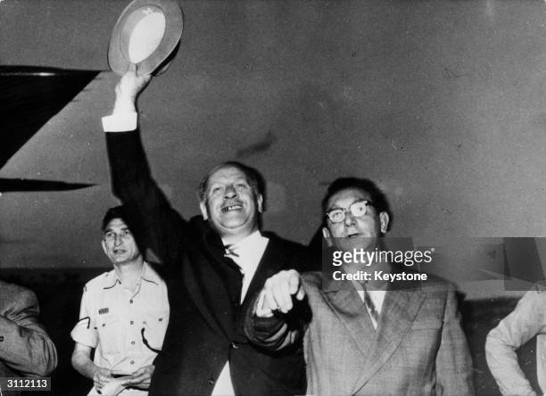 German industrialist Oskar Schindler waving after his arrival at Jerusalem airport where he is to be honoured for saving the lives of over a thousand...