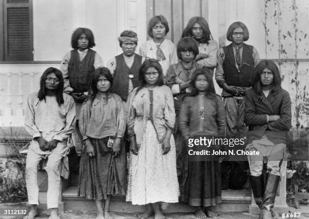 Group of Chiracahua Apaches on their first day at Carlisle Indian school.