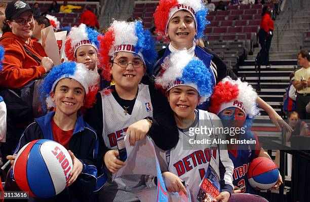 Detroit Pistons fans wear Ben Wallace afro wigs during NBA action against the Denver Nuggets March 19, 2004 at the Palace of Auburn Hills, in Auburn...
