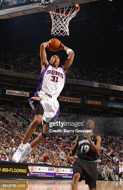 Shawn Marion of the Phoenix Suns shoots as Sam Cassell of the Minnesota Timberwolves chases on March 19, 2004 at America West Arena in Phoenix,...