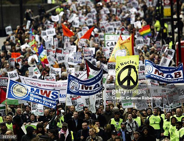 Anti-war demonstrators gather to mark the anniversary of the Iraq War March 20, 2004 in London. A march from Hyde Park to Trafalgar Square was held...