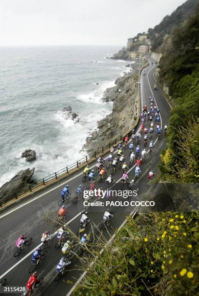 The pack of riders competes at the 95th edition of Milan-San Remo cycling race, ride next to the sea in Varazze, 20 March 2004. Spain's Oscar Gomez...