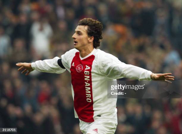 Swedish forward Zlatan Ibrahimovic of Ajax Amsterdam celebrates after scoring against Vitesse Arnhem during their Dutch premier league match in...
