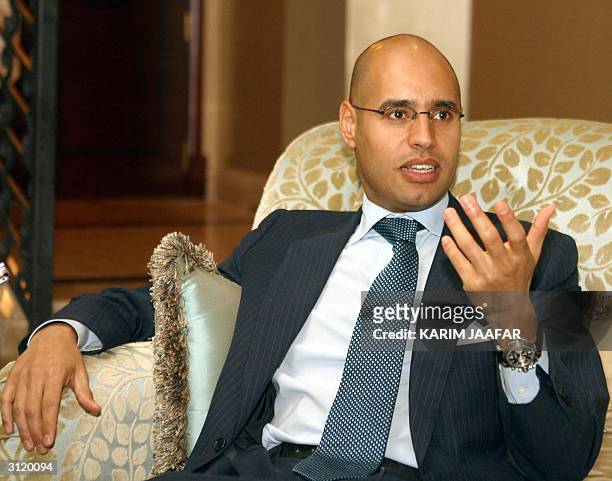 Saif ul-Islam Kadhafi, the son of Libyan leader Moamer Kadhafi, speaks to the press in Doha late 21 March 2004 during his two-day visit to Qatar. The...