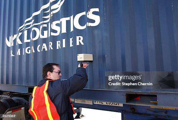 Customs inspector uses a radiation isotope identifier on a shipping container during an examination at the docks March 22, 2004 in Jersey City, New...