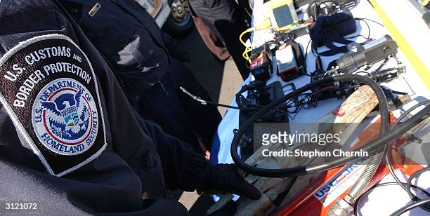 Customs inspectors prepare a variety of inspection devices used to examine incoming freight at the docks March 22, 2004 in Jersey City, New Jersey....