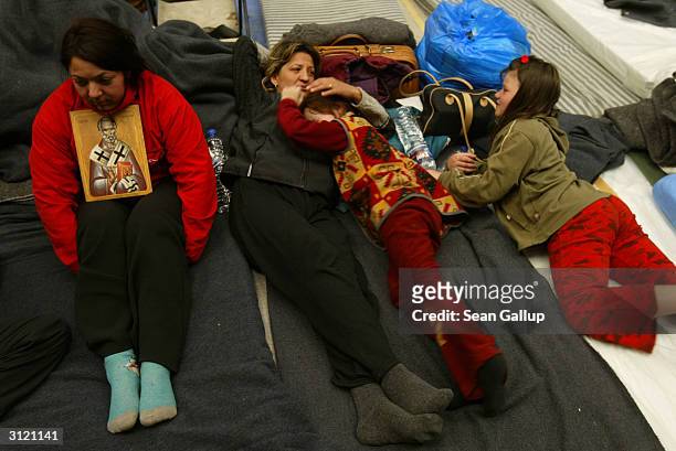 Serbian refugees Stanka Todorovic rests with her sister Jasmina , her daughter Milica Milosovic and relative Senka Stefanovic in a makeshift shelter...