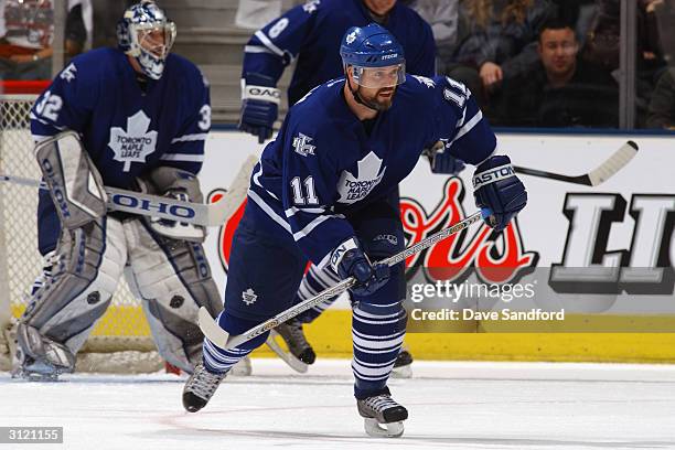 Owen Nolan of the Toronto Maple Leafs skates on offense during the game against the Montreal Canadiens at Air Canada Centre on February 21, 2004 in...