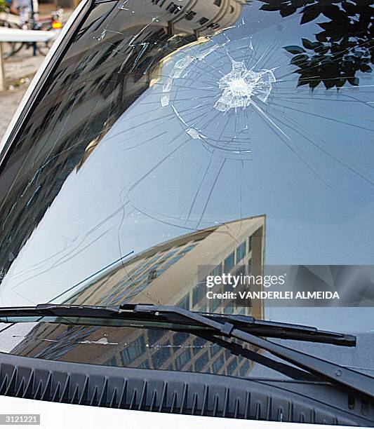 The windshield of an armored car attached to the US consulate in Rio de Janeiro, Brazil shows 22 March, 2004 a crack caused by the blast of a Molotov...