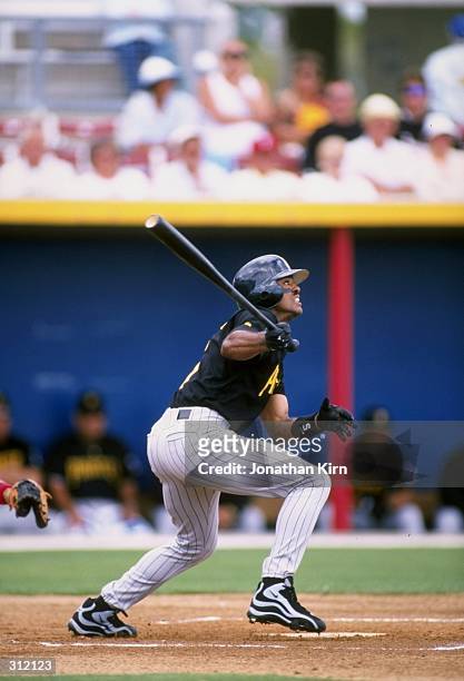 Tony Womack of the Pittsburgh Pirates in action during a spring training game against the Texas Rangers at the Charlotte County Stadium in Port...