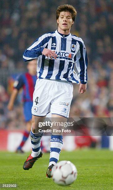 Xabi Alonso of Real Sociedad in action during the Primera Liga match between Barcelona and Real Sociedad on March 21, 2004 at the Nou Camp stadium in...