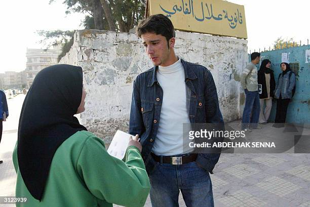 Moroccan students stand 20 March 2004 in front of their high school in Tangiers' Bani Makada quarter, a popular Islamic fundamentalist stronghod....