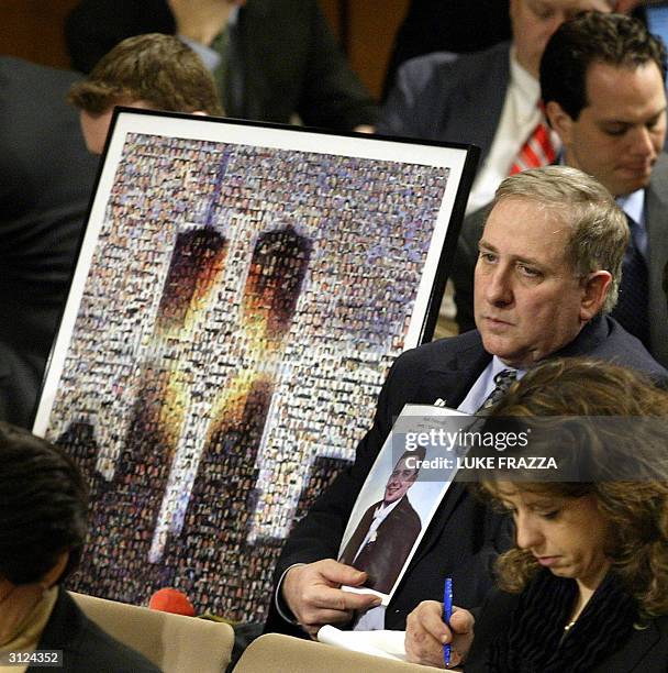 Bruce DeCell, the father-in-law of 9-11 victim Mark Petrocelli , listens to testimony before The National Commission on Terrorist Attacks Upon the...