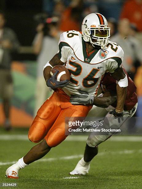 Defensive back Sean Taylor of the Miami Hurricanes attempts to elude wide receiver P.K. Sam of the Florida State Seminoles during the 2004 Orange...