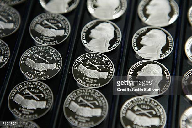 Freshly made proof versions of the new Louisiana Purchase nickels are seen on display at the U.S. Mint March 23, 2004 in San Francisco, California....