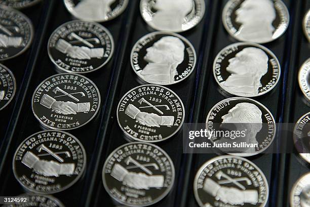 Freshly made proof versions of the new Louisiana Purchase nickels are seen on display at the U.S. Mint March 23, 2004 in San Francisco, California....