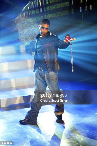 Usher performs for AOL to celebrate his new album release "Confessions" at Webster Hall March 23, 2004 in New York City.