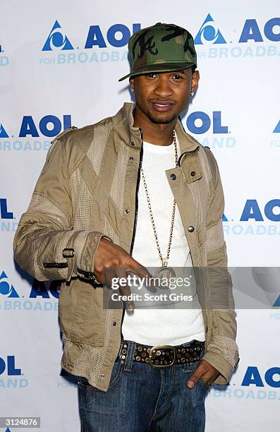 Usher poses for a photo before his performance for AOL to celebrate his new album release "Confessions" at Webster Hall March 23, 2004 in New York...