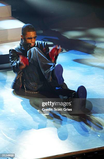 Usher performs for AOL to celebrate his new album release "Confessions" at Webster Hall March 23, 2004 in New York City.