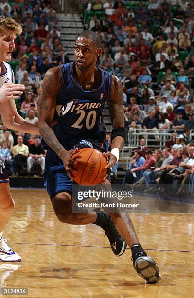 Larry Hughes of the Washington Wizards drives to the basket against the Utah Jazz on March 23, 2004 at the Delta Center in Salt Lake City, Utah. NOTE...