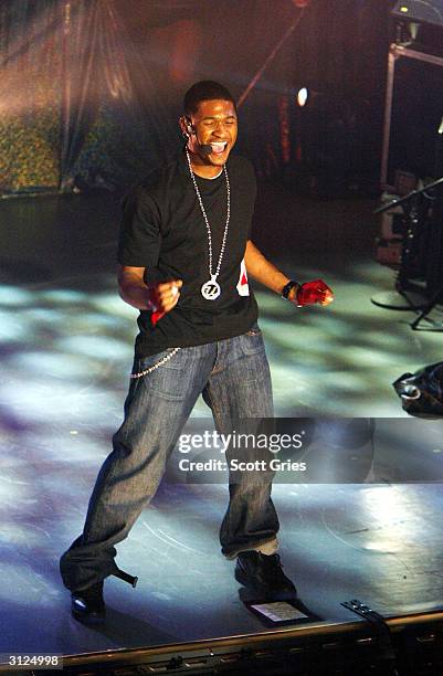 Usher performs for AOL to celebrate his new album release "Confessions" at Webster Hall March 23, 2004 in New York City.