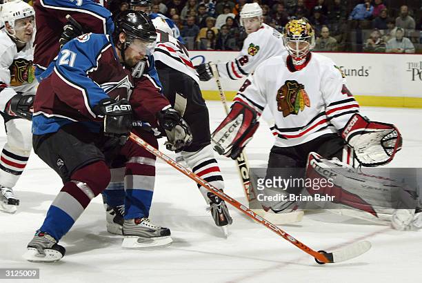 Peter Forsberg of the Colorado Avalanche can't get a good angle on goalie Michael Leighton of the Chicago Blackhawks in overtime March 23, 2004 at...