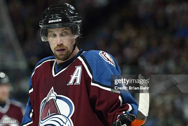 Peter Forsberg of the Colorado Avalanche waits for the puck to drop on a face-off against the Chicago Blackhawks March 23, 2004 at the Pepsi Center...