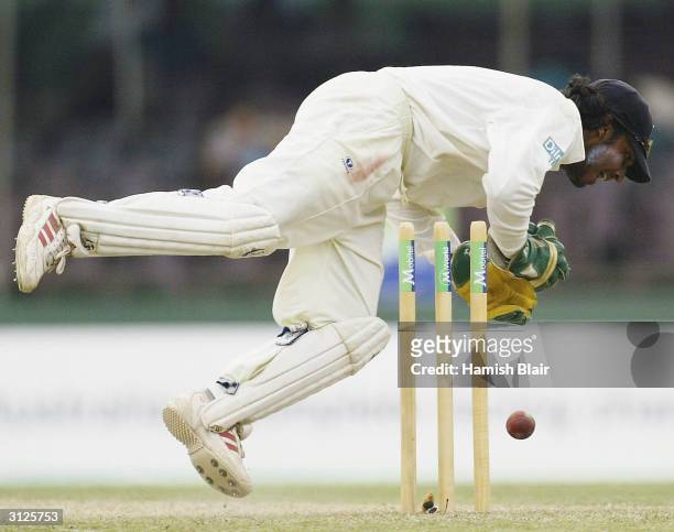 Kumar Sangakkara of Sri Lanka attempts to collect the ball as it hits the stumps during day one of the Third Test between Australia and Sri Lanka...