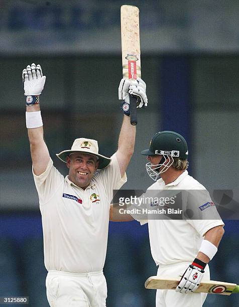 Darren Lehmann of Australia celebrates his century with team mate Shane Warne during day one of the Third Test between Australia and Sri Lanka played...