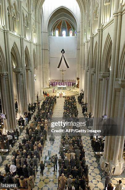 Memorial mass for the 190 identified victims of the March 11 train bombings in Madrid starts at the city's Almudena Cathedral, 24 March 2004. US...