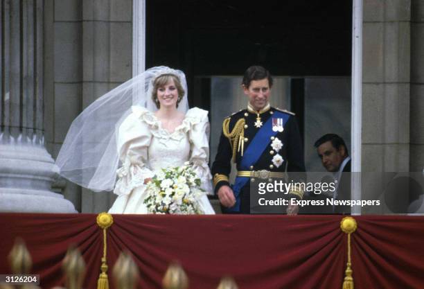 Prince Charles & Princess Diana stand on the balcony of Buckingham Palace after their wedding ceremony at St. Paul's Cathedral, London, England, July...