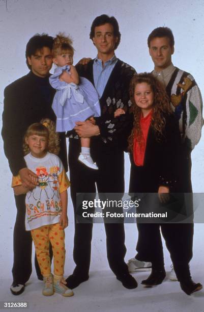 Portrait of the cast of the television program, 'Full House,' : John Stamos, Jodie Sweetin, Ashley or Mary-Kate Olsen, Bob Saget, Candace Cameron,...