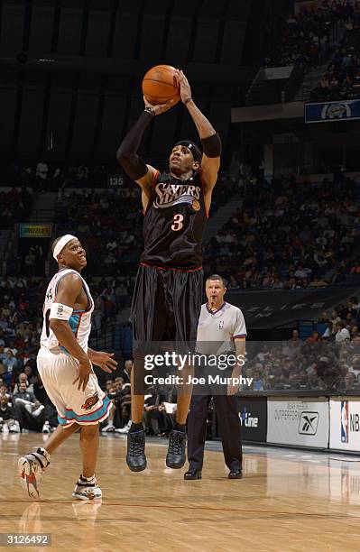 Allen Iverson of the Philadelphia 76ers shoots against the Memphis Grizzlies during the game at The Pyramid on March 16, 2004 in Memphis, Tennessee....