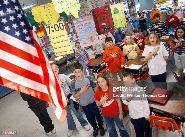 Fourth graders at Longstreth Elementary School pledge allegiance to the flag March 24, 2004 in Warminster, Pennsylvania. An atheist parent, Michael...