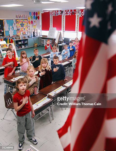 First graders at Longstreth Elementary School pledge allegiance to the flag March 24, 2004 in Warminster, Pennsylvania. An atheist parent, Michael...
