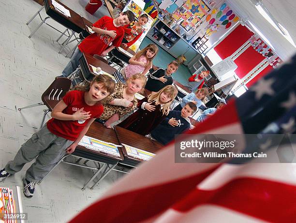 First graders at Longstreth Elementary School pledge allegiance to the flag March 24, 2004 in Warminster, Pennsylvania. An atheist parent, Michael...