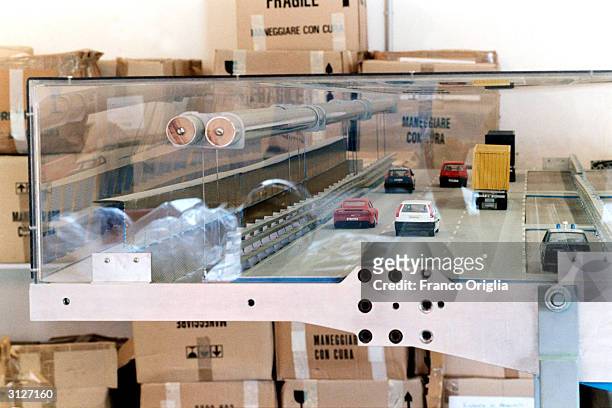 Plastic wind gallery of the planned bridge over the Strait of Messina, designed by Pininfarina, is shown with small toy vehicles March 24, 2004 in...