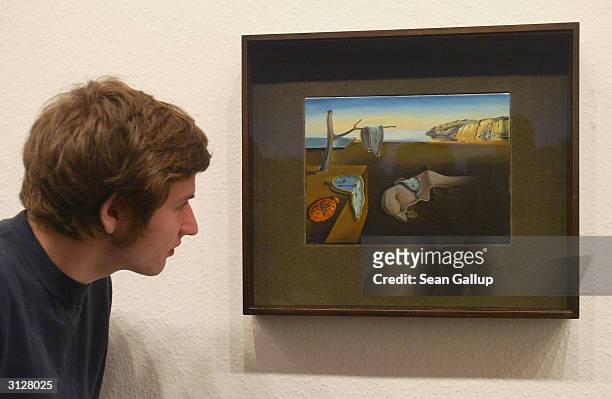 Visitor takes a look at Salvador Dali's "The Persistence of Memory" at the MoMA exhibit, on March 24, 2004 in Berlin, Germany. The exhibit, which...
