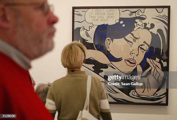 Visitors take a look at Roy Lichtenstein's "Drowning Girl" at the MoMA exhibit, on March 24, 2004 in Berlin, Germany. The exhibit, which opened...