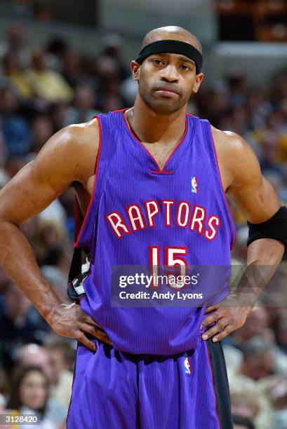 Vince Carter of the Toronto Raptors stands on the court during the game against the Indiana Pacers at Conseco Fieldhouse on March 9, 2004 in...