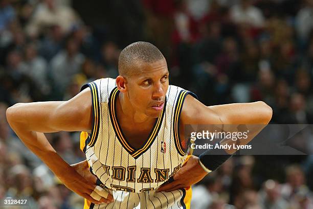 Reggie Miller of the Indiana Pacers stands on the court during the game against the Toronto Raptors at Conseco Fieldhouse on March 9, 2004 in...