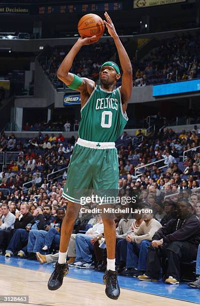 Walter McCarty of the Boston Celtics shoots against the Washington Wizards during the game at MCI Center on March 13, 2004 in Washington DC. The...