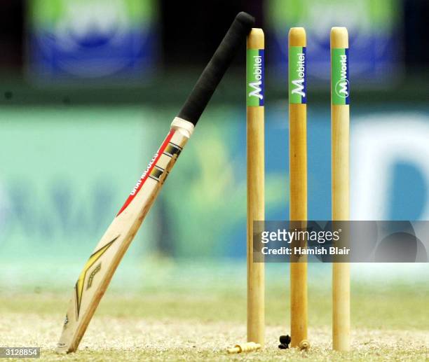 The bat of Darren Lehmann of Australia rests against the stumps during the drinks break in the same way his late friend and former Australian batsman...