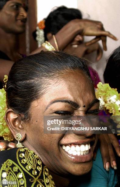 An Indian eunuch laughs during a meeting to discuss a High Court Judgement in Madras, 25 March 2004. Madras High Court issued a judgement 23 March,...