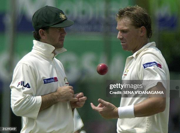 Australian cricket captain Ricky Ponting talks with bowler Shane Warne during the seond day of the final Test match between Sri Lanka and Australia...