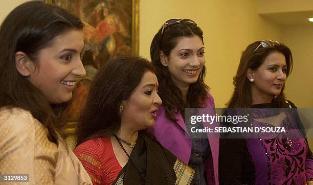 Indian actresses Smriti Irani Apra Mehta former Miss World Yukta Mookhey and Poonam Dhillon pose for photographers during a Bharatiya Janata Party...