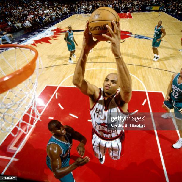 Charles Barkley of the Houston Rockets goes for a dunk against the Charlotte Hornets during the NBA game circa 1997 in Houston, Texas. NOTE TO USER:...