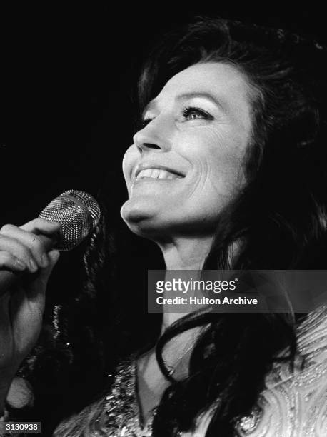 American country music singer and guitarist Loretta Lynn performs on stage in California, 1972.
