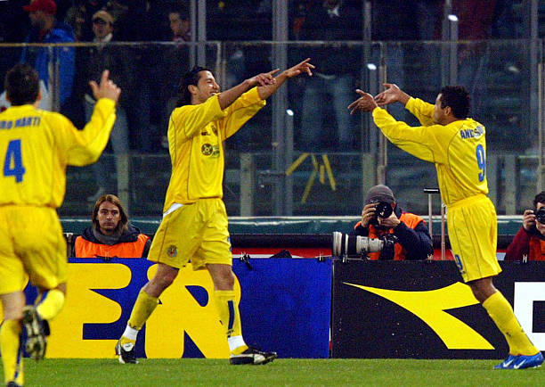 Anderson Da Silva of Villareal celebrates with teammates Jose Mari and Pedro Martin Castello after scoring against AS Roma in a UEFA Cup fourth-round...