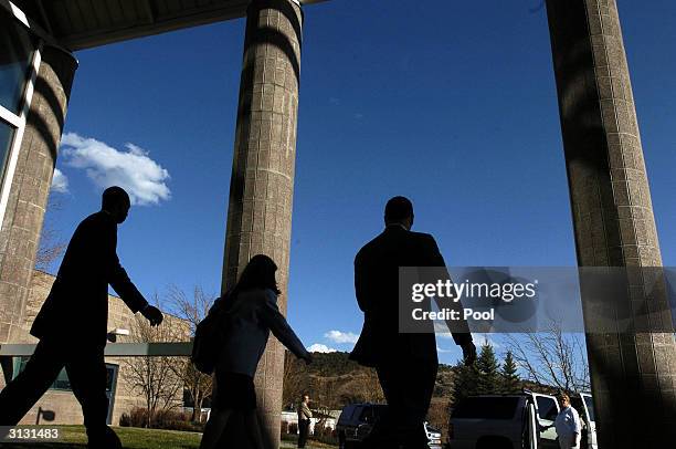 Lakers star Kobe Bryant, his attorney Pam Mackey and his security leave the Eagle County Justice Center at the end of the second day of hearings.